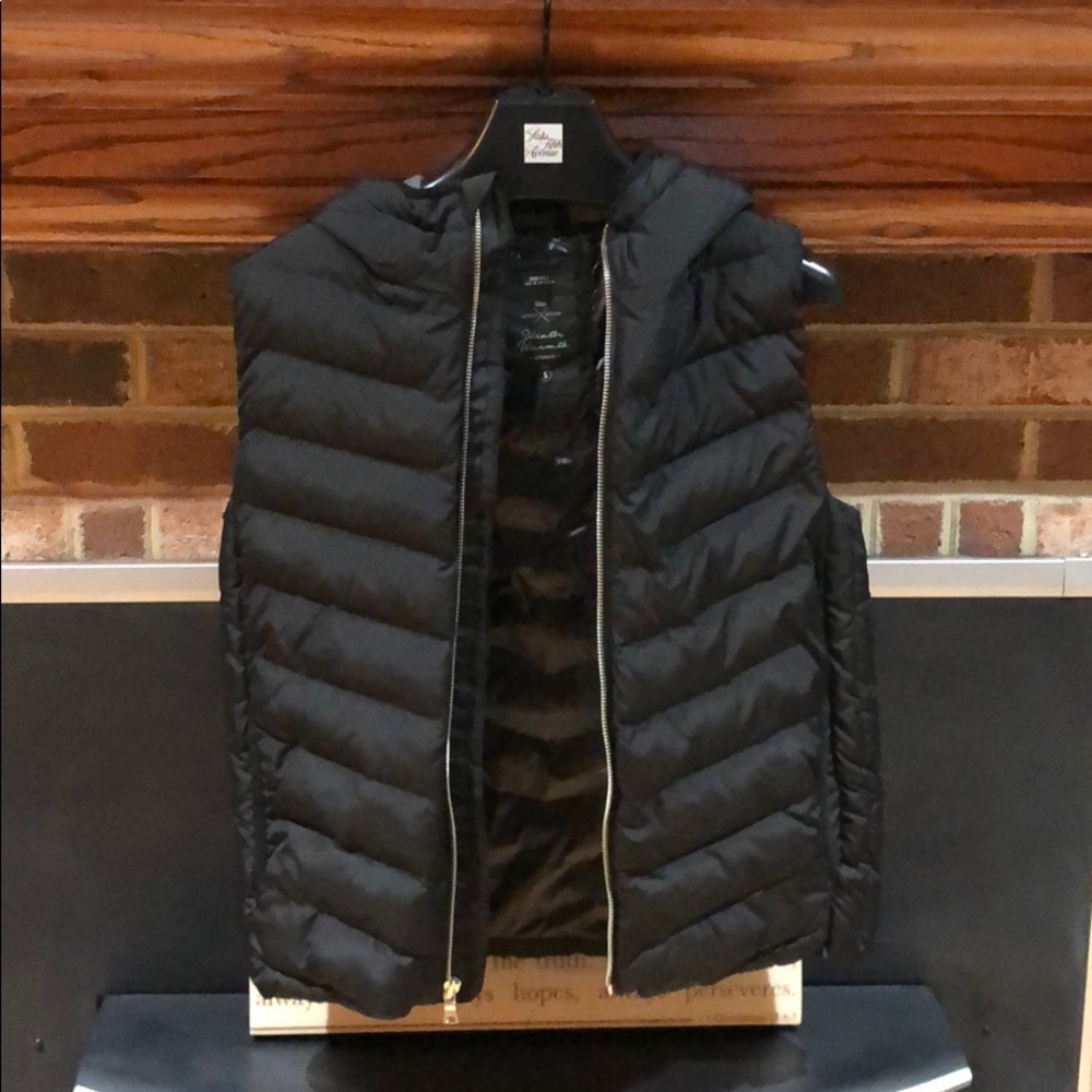Black vest size Small. Never worn